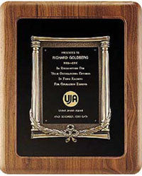 American walnut plaque with antique bronze casting